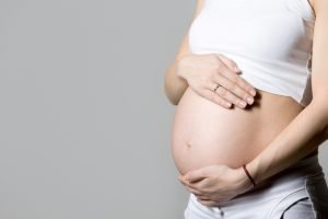 pregnant woman touching her belly 300x200 - ¿Qué derechos tiene una mujer embarazada?
